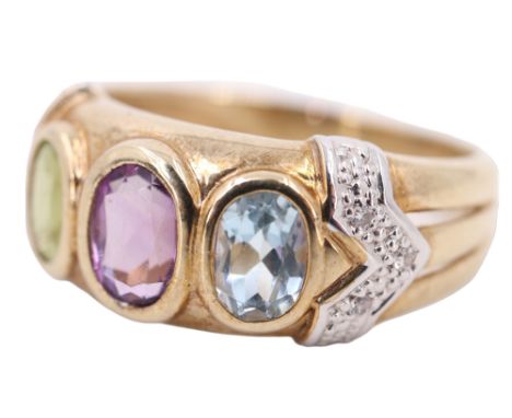 A three stone and diamond dress ring, having a 6 x 4 mm amethyst, flanked by a peridot and a blue spinel, all bezel set betwe