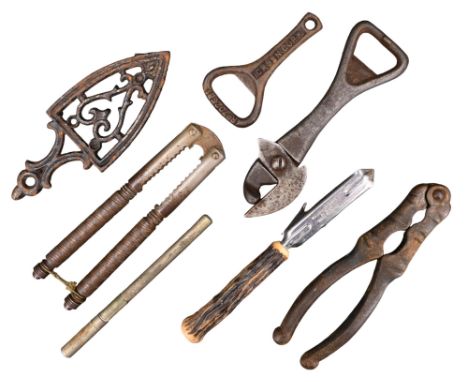 A group of vintage kitchenalia, including a Bully Beef style tin opener, nutcrackers, an antler handled bottle opener, a case