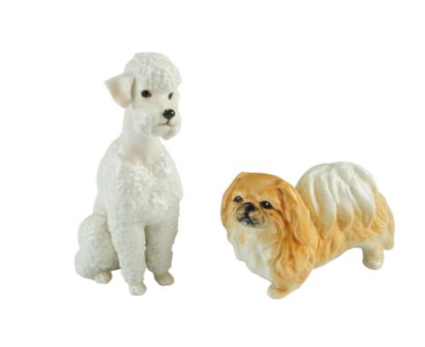 A Sylvac Pekinese together with a Poodle, the base marked 'J R, Germany', latter 17 cm