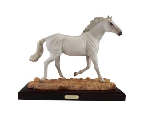 A limited edition Royal Doulton bisque figurine of a white stallion, 'Milton', model No DA245, on a mahogany base, 32.5 cm