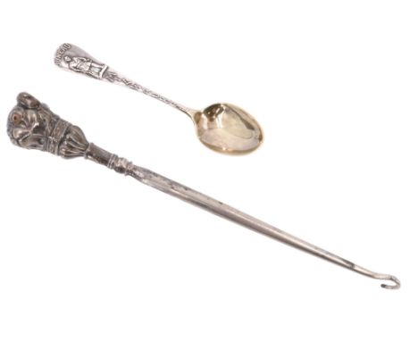 An Edwardian novelty silver handled button hook, the terminal in the form of a double dog's head having glass eyes, together 