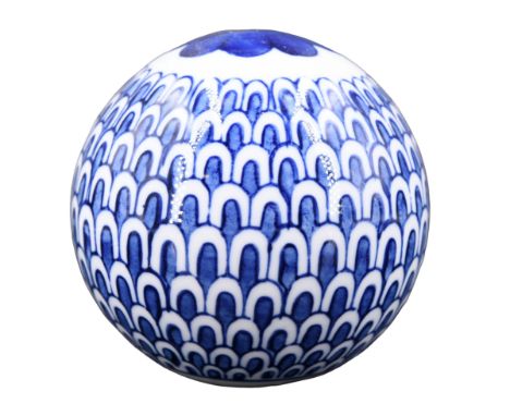 A contemporary Scottish carpet bowl, having blue-and-white fish scale decoration 