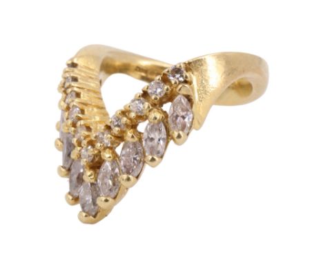 A striking diamond and 18 ct gold dress ring, comprising a chevron of claw-set diamond brilliants with a "fringe" of marquise