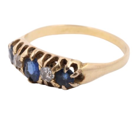 A mid-to-late 20th Century sapphire and diamond ring, having a 4 x 3 mm oval set between two 3 mm diamond brilliants, in turn