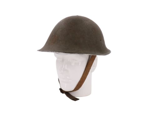 A Second World War British army Mk III steel helmet, its liner 1945 dated