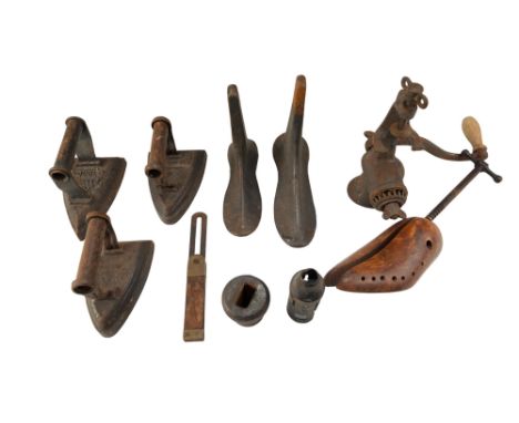 A group of vintage metalware, including flat irons, a cobblers last, etc