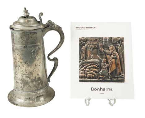 A George I pewter church spire flagon having a tapering drum with high reeded fillet, the double-dome lid with a 'pagoda' fin