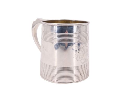 A Victorian silver tankard, of tapering cylindrical form with a loop handle and having horizontal linear engraved bands, gilt