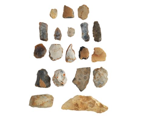 An old collection of prehistoric flint implements including arrow heads, scrapers, etc