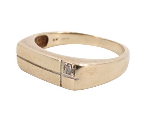 A contemporary diamond-set 9 ct gold signet ring, having an slender oblong face, cruciform line engraved, one small quadrant 