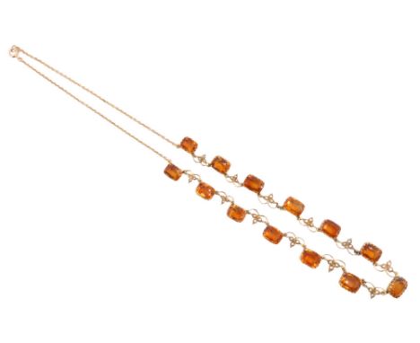 A Victorian citrine and seed pearl necklace, comprising 13 adorsed graduated radiant cut stones, each in a plain multi-claw s