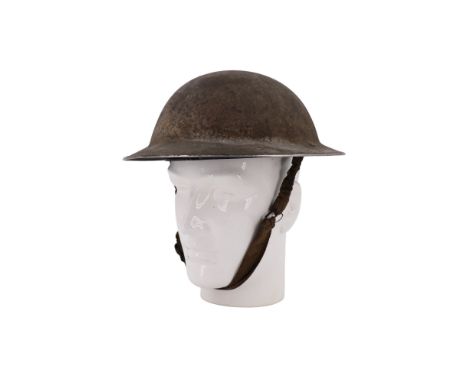 A Second World War British army Mk II steel helmet, its rim faintly inscribed including "Border Regt"