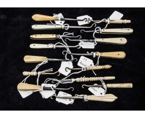 A collection of fifteen Victorian and later bone handled button hooks