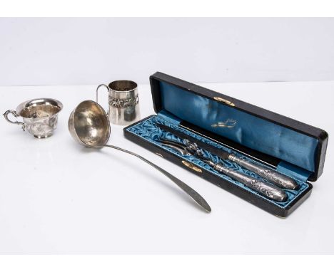 A cased Swiss carving set and three other items, including a tea cup with engraved inscription, a Christening tankard and a s