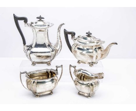 An Edwardian silver four piece tea set by John Round & Son, 68.6 ozt, comprising teapot, hot water pot, sugar basin and milk 