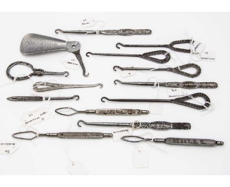 Fourteen Victorian and later Advertising and Retailers metal button hooks and shoe horns