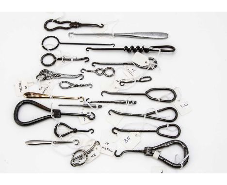 A collection of Victorian and later small metal button hooks, approx 21, various designs