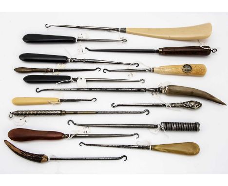A collection of 14 various Victorian and later button hooks and shoe horns, one with resin handle having portrait of Marie An