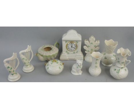 A collection of 'Shamrock' pattern Belleek ware, various dates, to include; a mantle clock, two-handled jug, lidded sugar pot