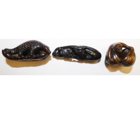 A Japanese hardwood carved netsuke, in the form of a dragon fly on a gourd, inset signature, length 7 cm, another of an ant e