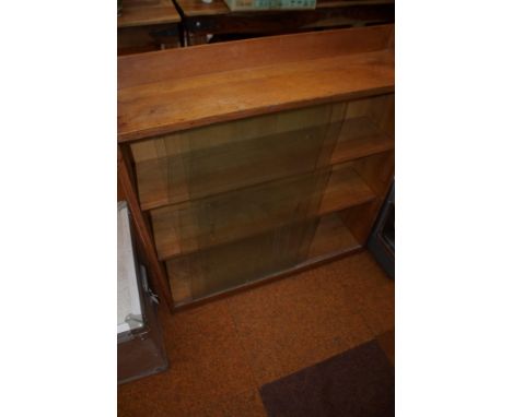 Free standing book shelf with sliding glass doors 