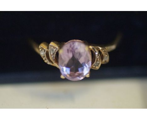 9ct Gold ring set with light purple stone &amp; diamonds 