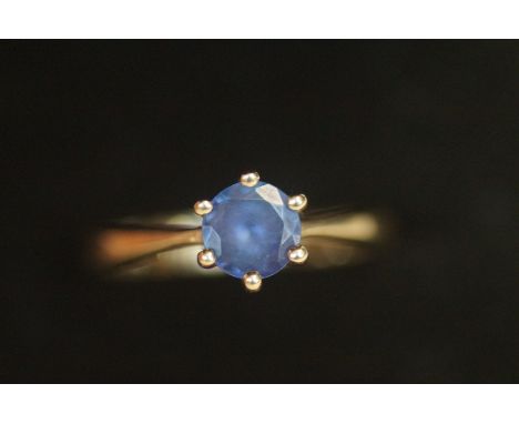 9ct Gold ring with light blue stone 