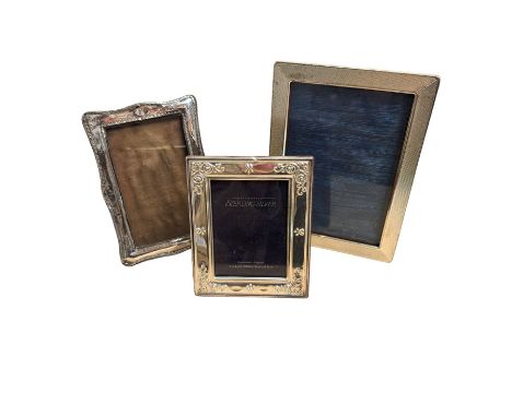 Two silver photograph frames, hallmarked and a plated frame, largest H17.5cm