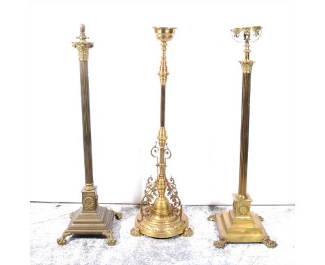 A modern brass Corinthian column standard lamp, fluted shaft, square base, as assembled, 132cm; and two brass oil lamp bases.