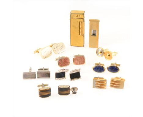 A collection of cufflinks in mainly plated materials, one pair marked 925 by Dunhill, Balmain, a Dunhill gold-plated cigarett