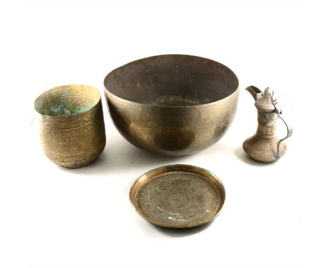 An Indian engraved brass circular basin, diameter 40cm; and other Eastern metal ware. (Qty: 7)