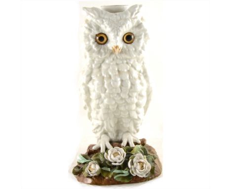 A Victorian porcelain lamp base, designed as an owl, with glass eyes, encrusted floral decoration, 27cm.