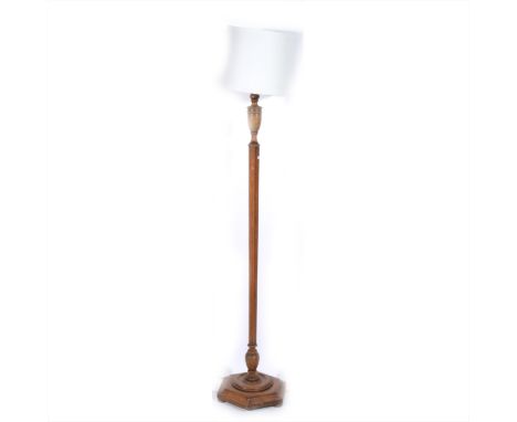 An oak standard lamp, hexagonal tapering column, with shade, 173cm overall.