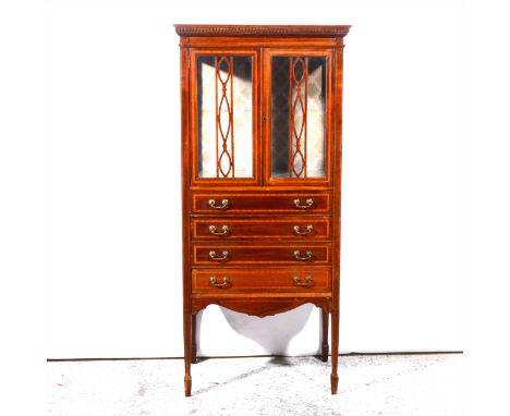 An Edwardian inlaid mahogany music/display cabinet, with satinwood banding and stringing, two glazed doors, enclosing plate-g