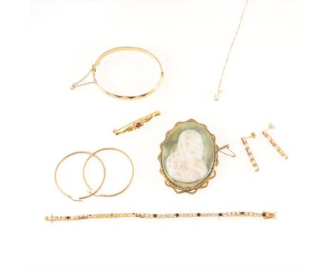 A collection of costume jewellery, a 9ct gold filled half hinged bangle, a madonna brooch in metal frame, a pair of silver-gi