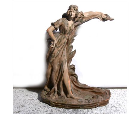 An Art Nouveau Goldscheider style painted terracotta figural mirror stand, lacking plate, modelled with a standing figure, in