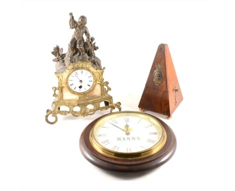 A spelter, onyx and gilt metal mantel clock, the circular dial housed in a scrolling gilt frame, surmounted by a young fisher