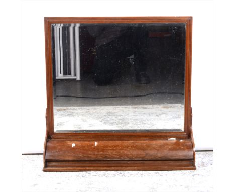 A Victorian mahogany shelf mirror, rectangular bevelled plate with a hinged compartment.