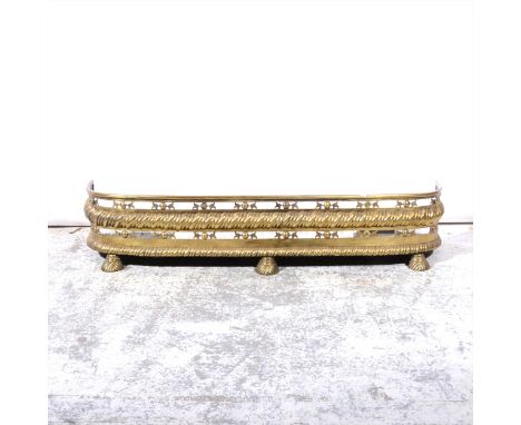 An Edwardian style brass rail fender, length 142cm; and two other brass fenders. (Qty: 3)