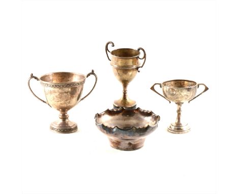 A silver two-handled trophy cup, Alexander Clark &amp; Co Ltd., Birmingham 1937, cast foliate outlines, 4oz, 11.5cm, plus two