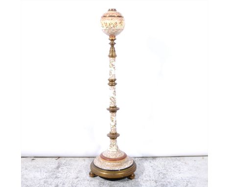 A Victorian earthenware and lacquered brass standard lamp base, with near spherical reservoir, ringed column, circular base, 
