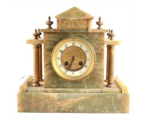 A French onyx and gilt metal mantel clock, ivorine chapter ring, movement striking on a gong, 29cm.