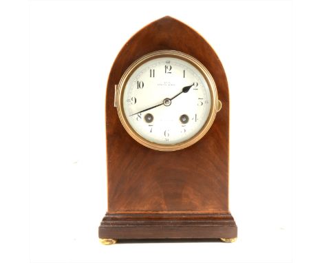 Mahogany lancet shaped mantel clock, plinth base with four bun feet, inscribed A. Smith &amp; Son, Croydon, striking hand and