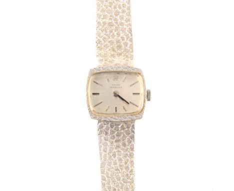 Girard-Perigueux - a lady's white metal bracelet watch, the silvered TV shape baton dial in a 17mm x 19mm white metal case wi