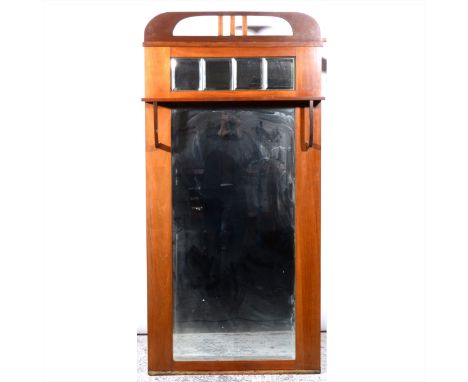 A Continental Art Deco style pier glass, rectangular bevelled plate, under a shelf canopy, with four glass tiles over, width 