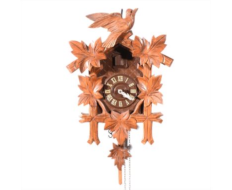 Beech cased cuckoo clock, twin pine-cone weights, case height 37cm