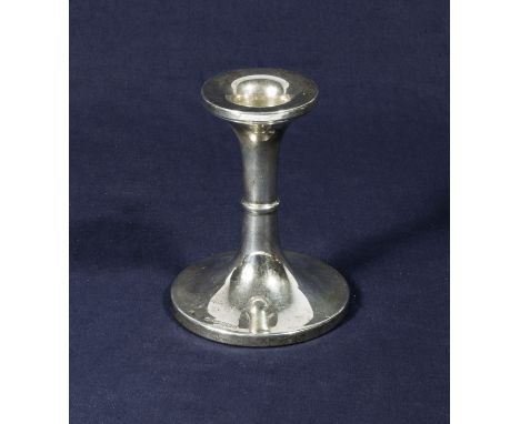 A silver candlestick 10cm tall