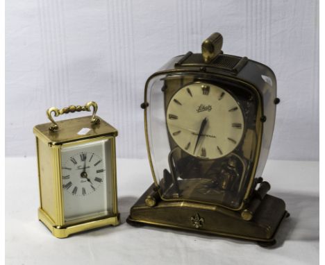 A vintage Schatz mantle clock and a carriage clock