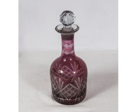 An etched ruby glass decanter