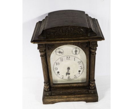 A Victorian oak cased bracket clock  Westminster chime, silvered face